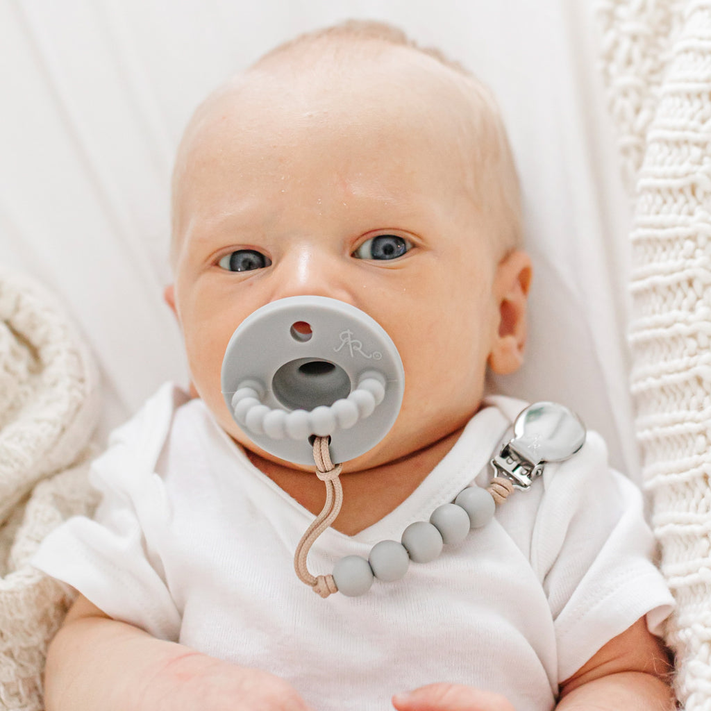 Baby boy wearing a Slate Cutie PAT and Quinn Cutie Clip.