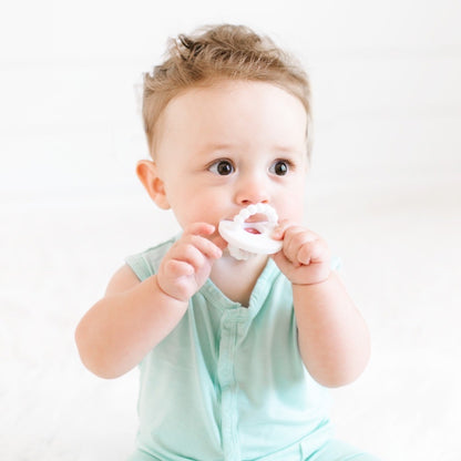 Baby teething on the White Cutie Bit.