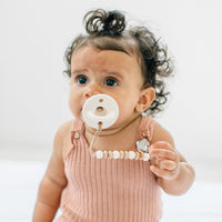 Baby using a Ray Cutie Clip attached to a Cutie PAT Round.