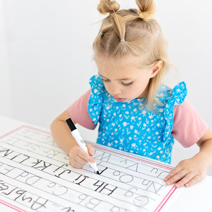 Girl tracing on the Cutie Mat.