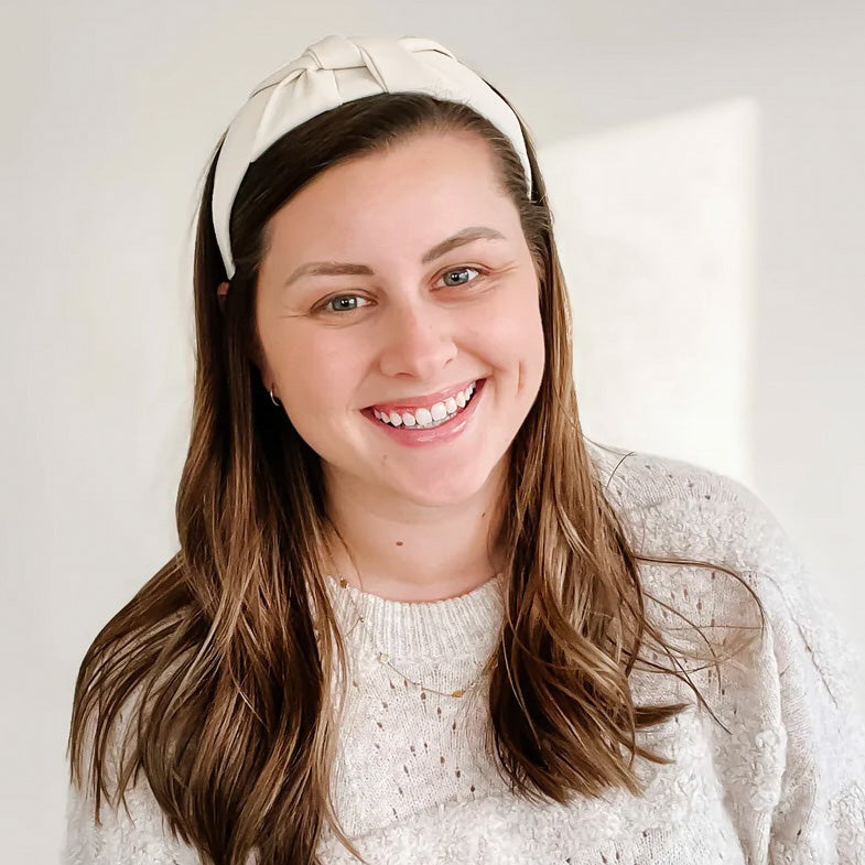 Woman wearing the Ivory Cutie Headband.