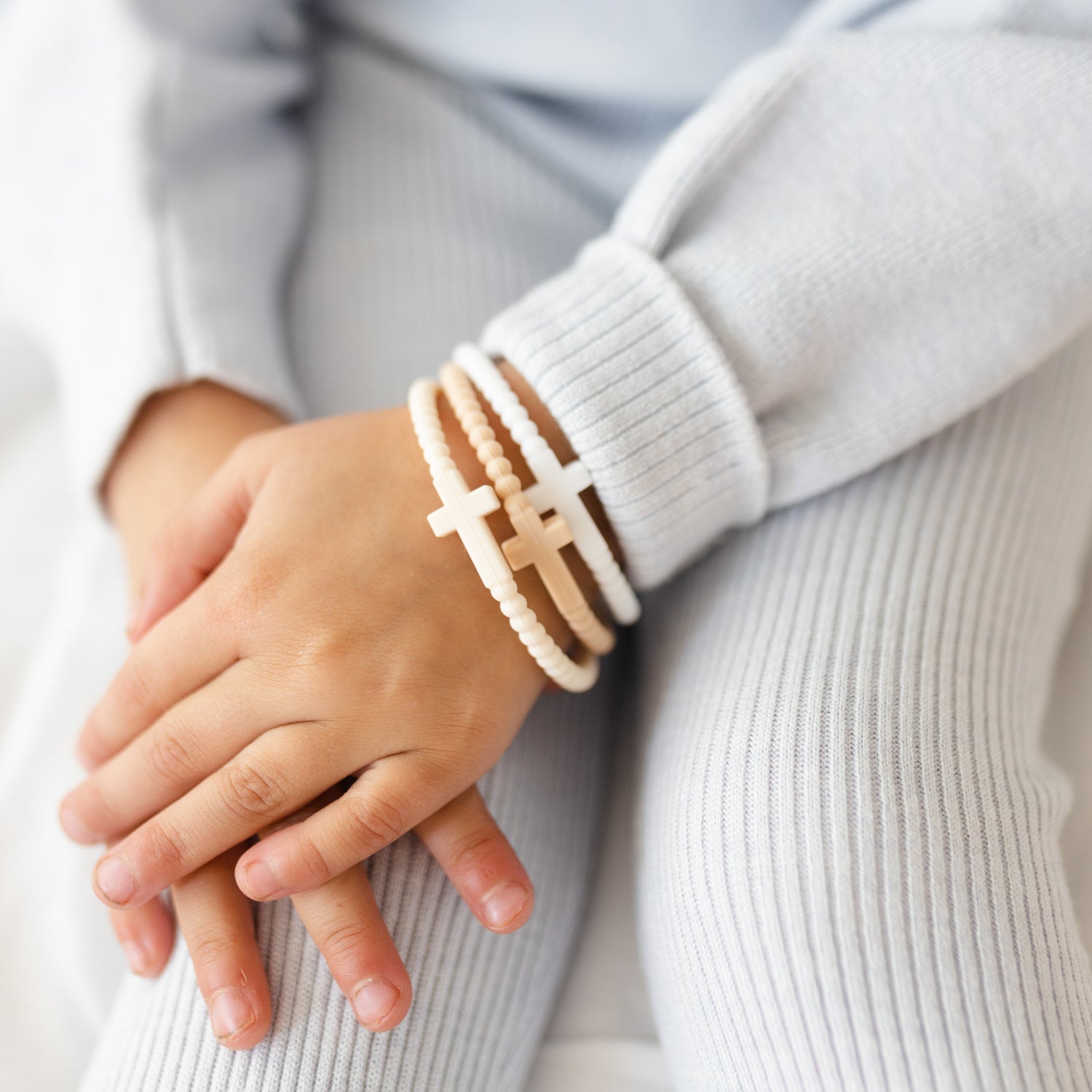 Child wearing the Serene Jesus Bracelets.