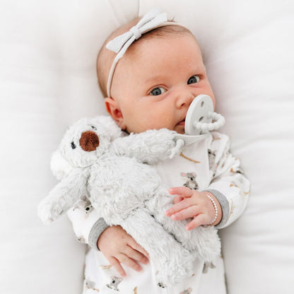 Baby using a Grey Cutie PAT attached to a Koala Cutie Cuddle.