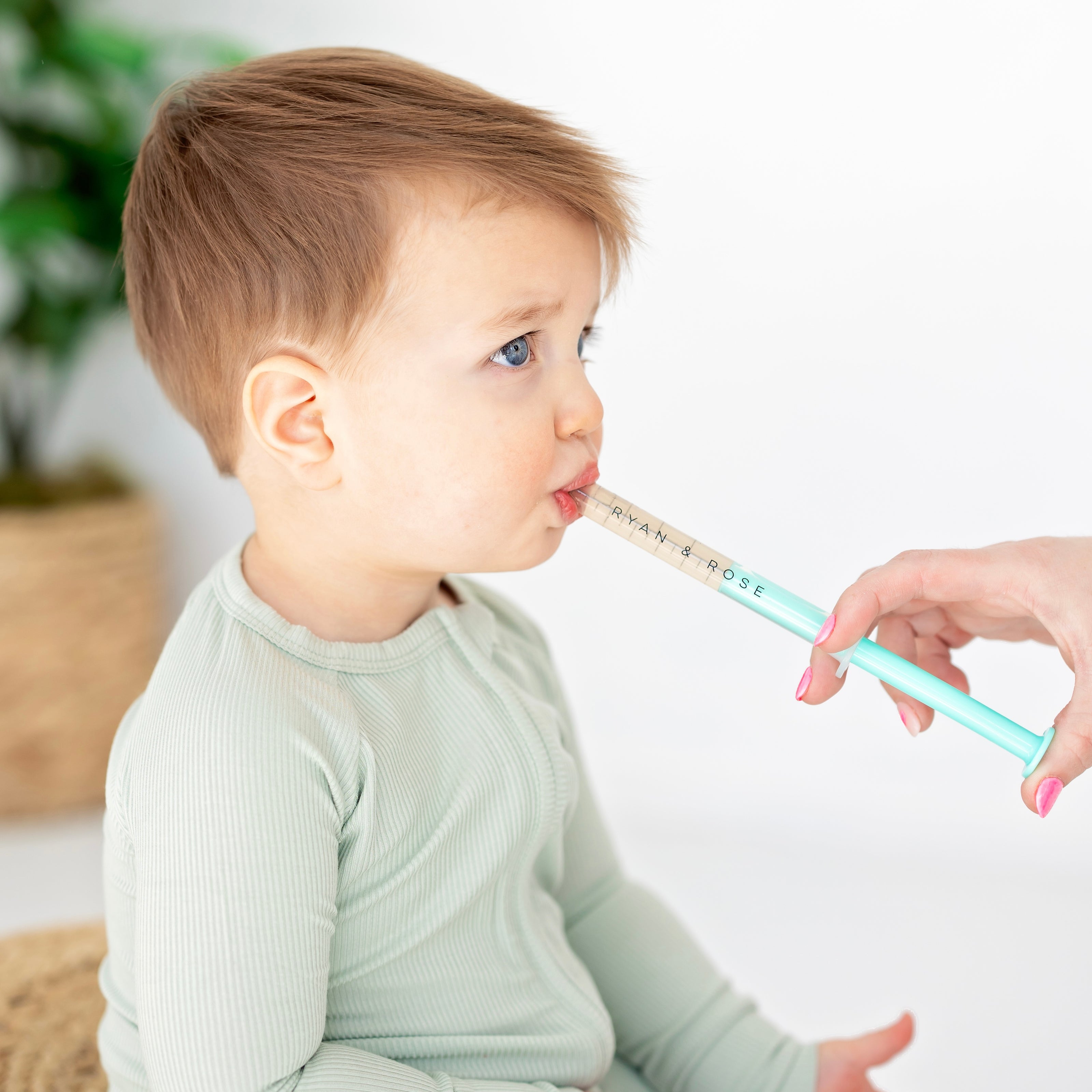 Baby getting medicine with dose