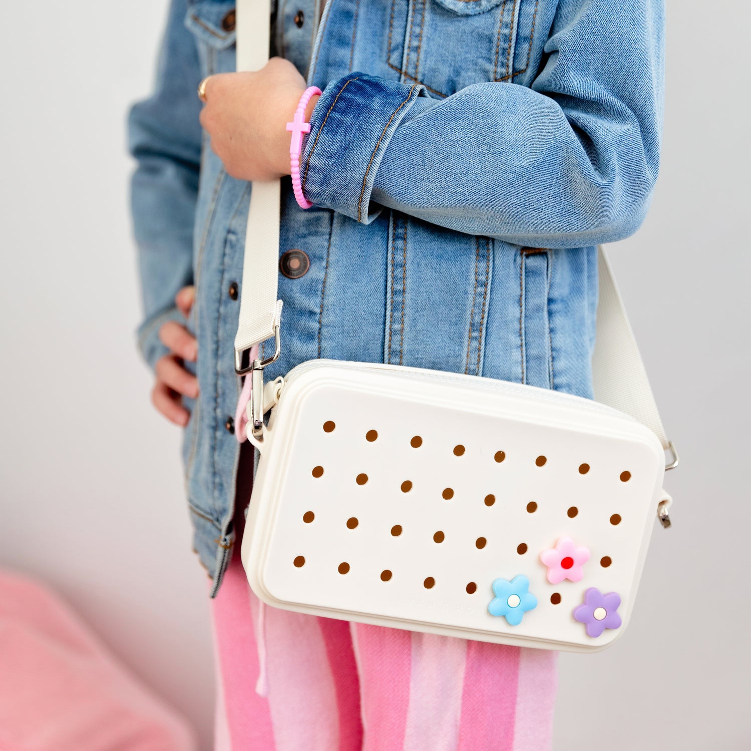 Girl wearing charm purse