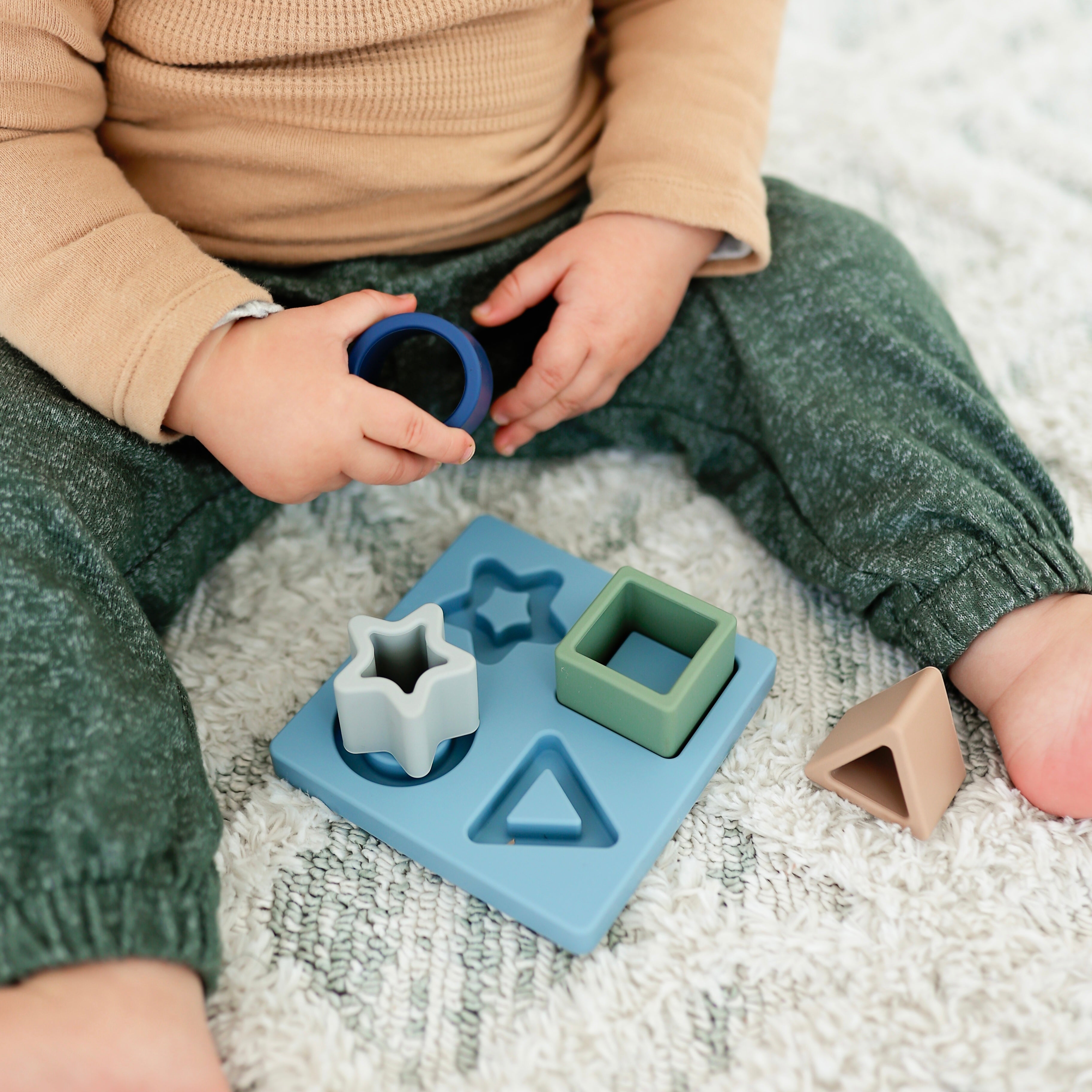 Baby boy playing with the Cutie Puzzle.