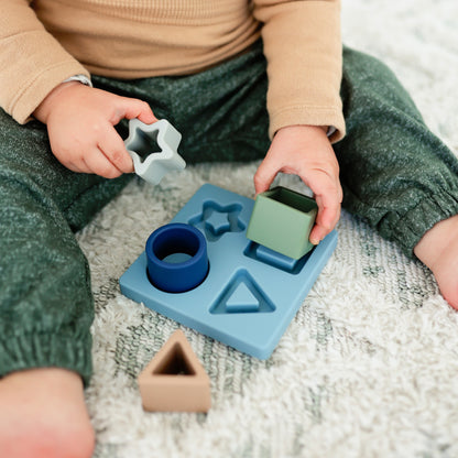 Baby boy playing with the Cutie Puzzle.