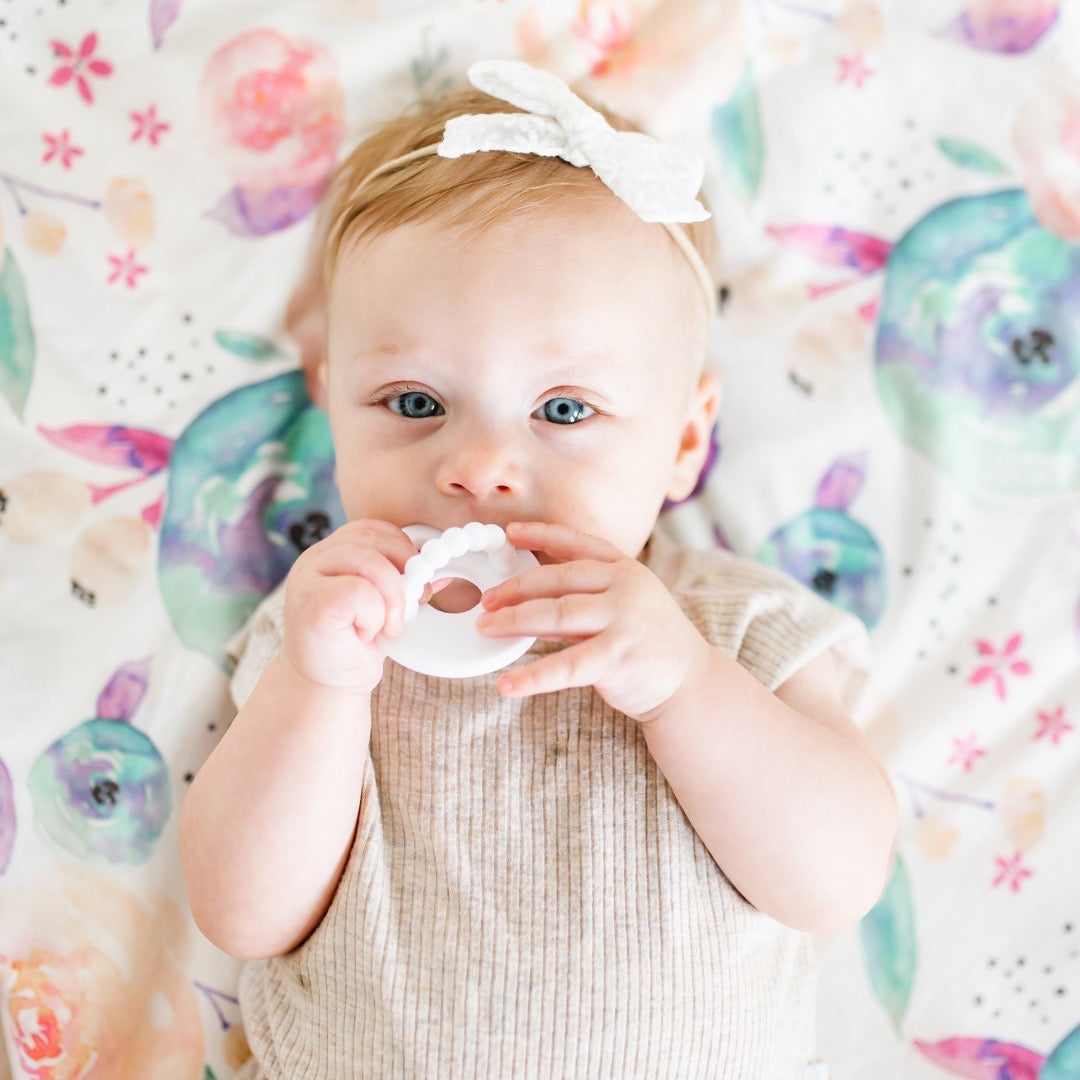 Baby teething on the White Cutie Bit.