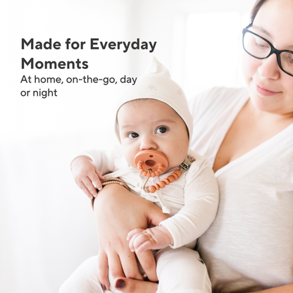 Woman holding a baby with text &