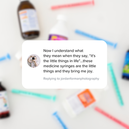 Text message on a blurred background with colorful syringes and bottles.