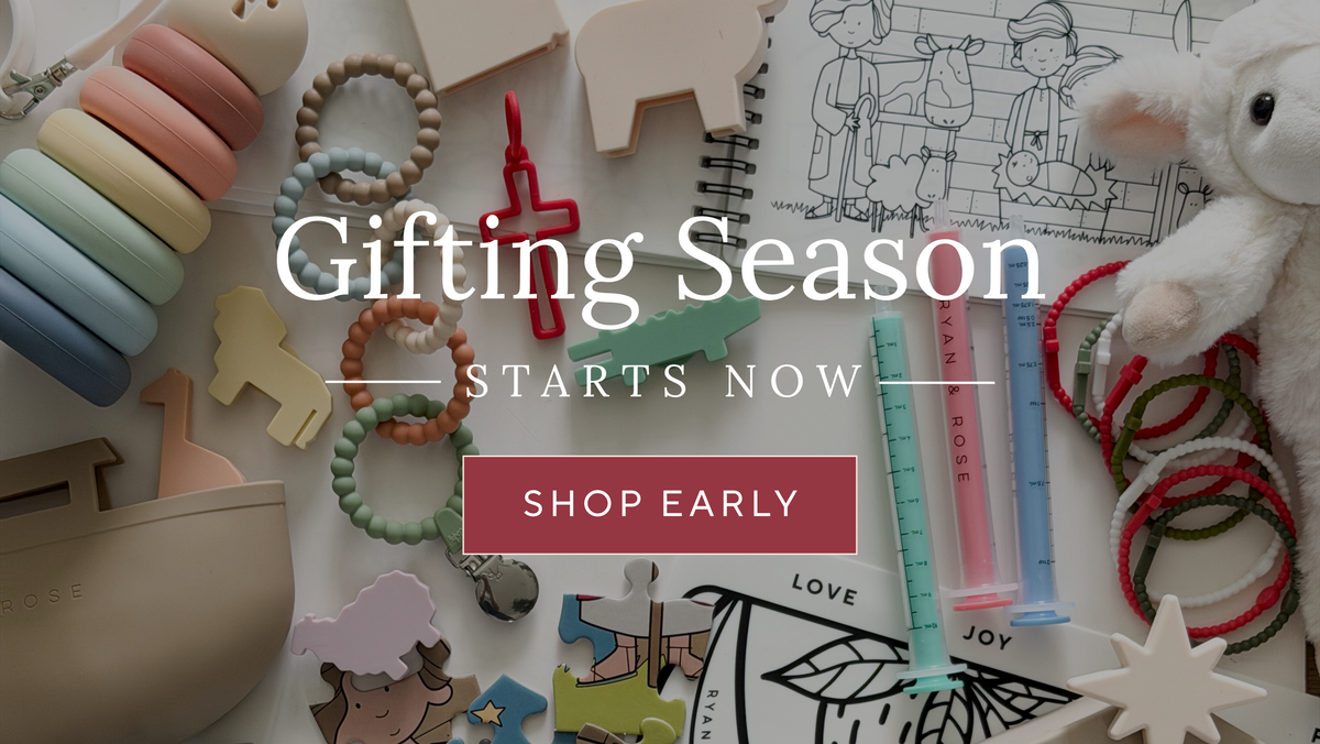 A styled flat-lay of assorted gift items on a light neutral background, including pastel wooden animal cutouts, bead necklaces, colorful hair ties, a plush toy, drawing books, and small decorative accessories. Large overlaid text reads 'Gifting Season Starts Now' with a 'Shop Early' button.