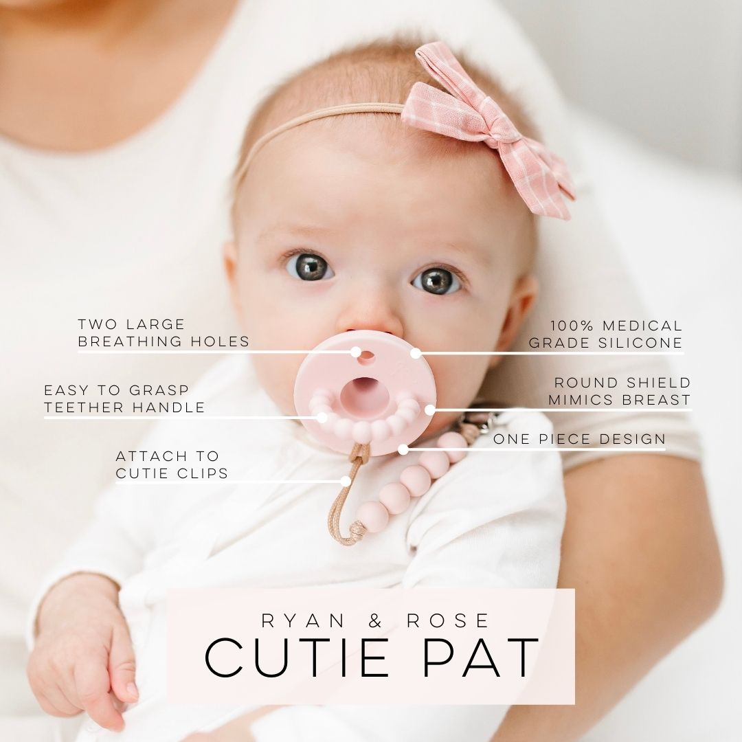 Baby wearing a Cutie PAT attached to a Cutie Clip.