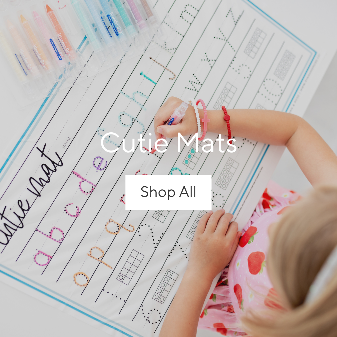 Girl tracing on Cutie Mat.