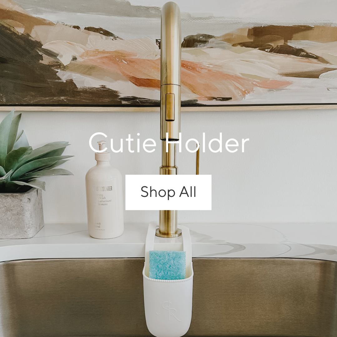 Cutie Holder attached to a kitchen faucet.