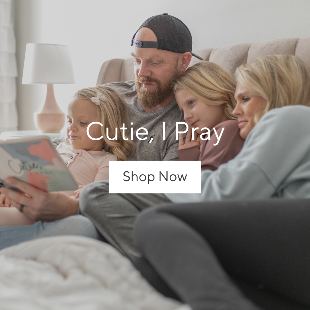 Family reading Cutie, I Pray together.