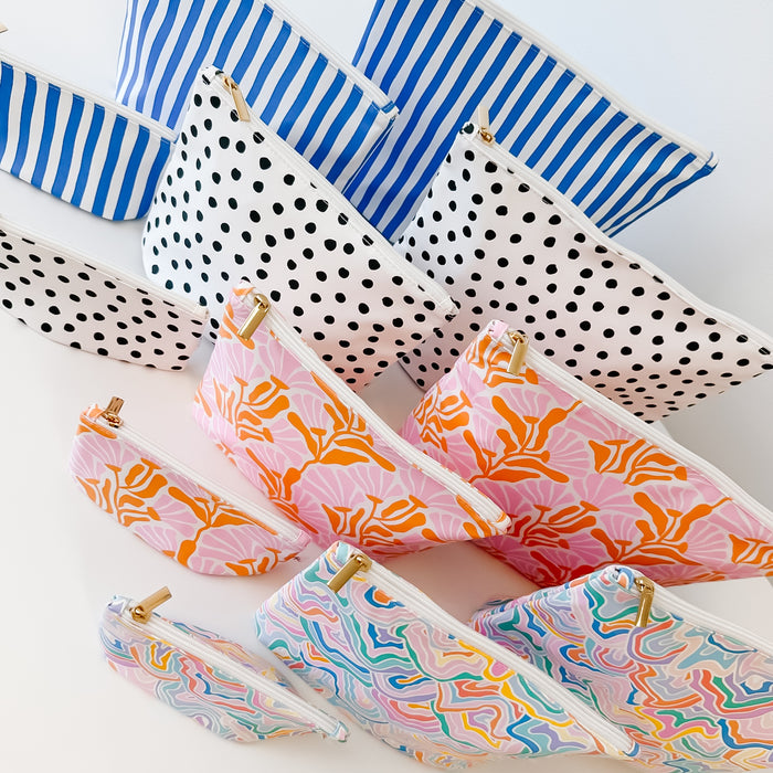 Collection of patterned pouches on a white background