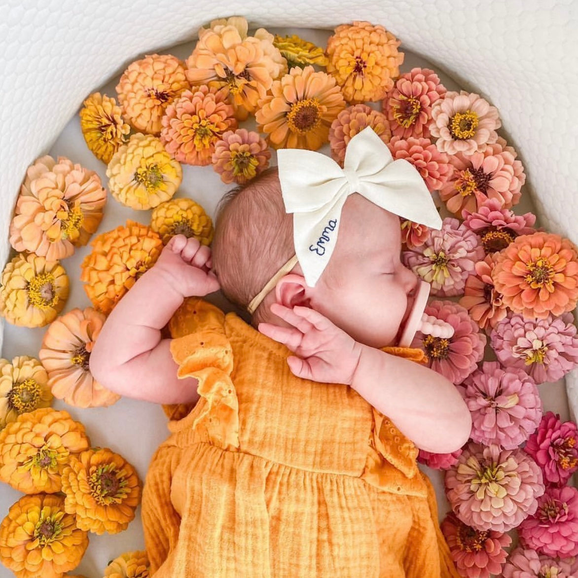 Baby with flowers in the background