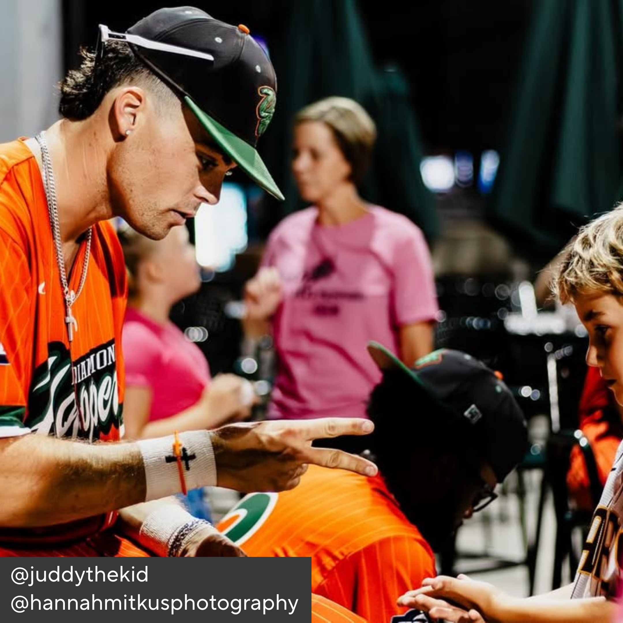 Person in orange shirt with &