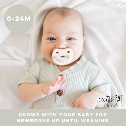 Baby using Ivory Cutie PAT Smile. For ages 0-24 months. The Smile grows with your baby from newborn to weaning.