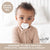 Baby using White Cutie PAT Smile. An orthodontic pro pacifier designed to help prevent open bite, crossbite & overjet.