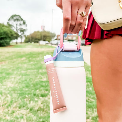 Lip balm holder on water bottle