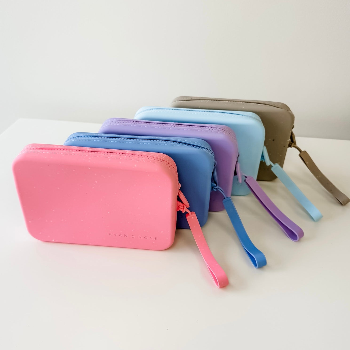 Set of colorful wallets with zippers on a white background