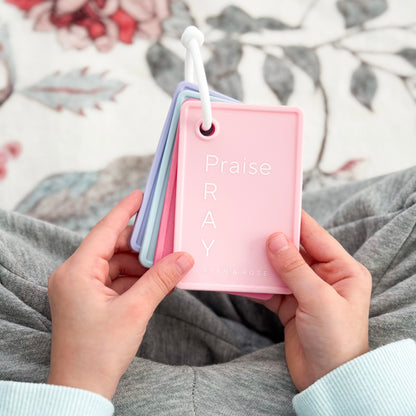 Girl holding prayer cards