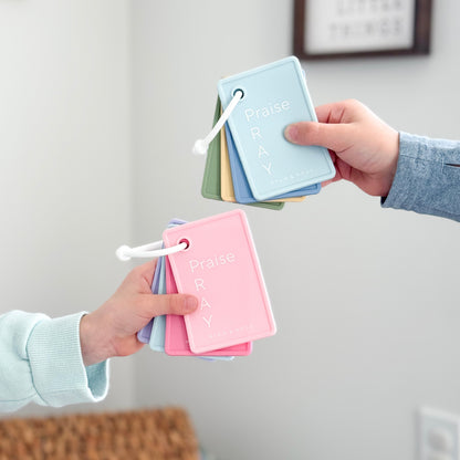 Kids holding prayer cards