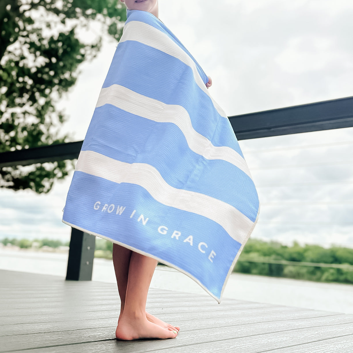 kid with a beach towel