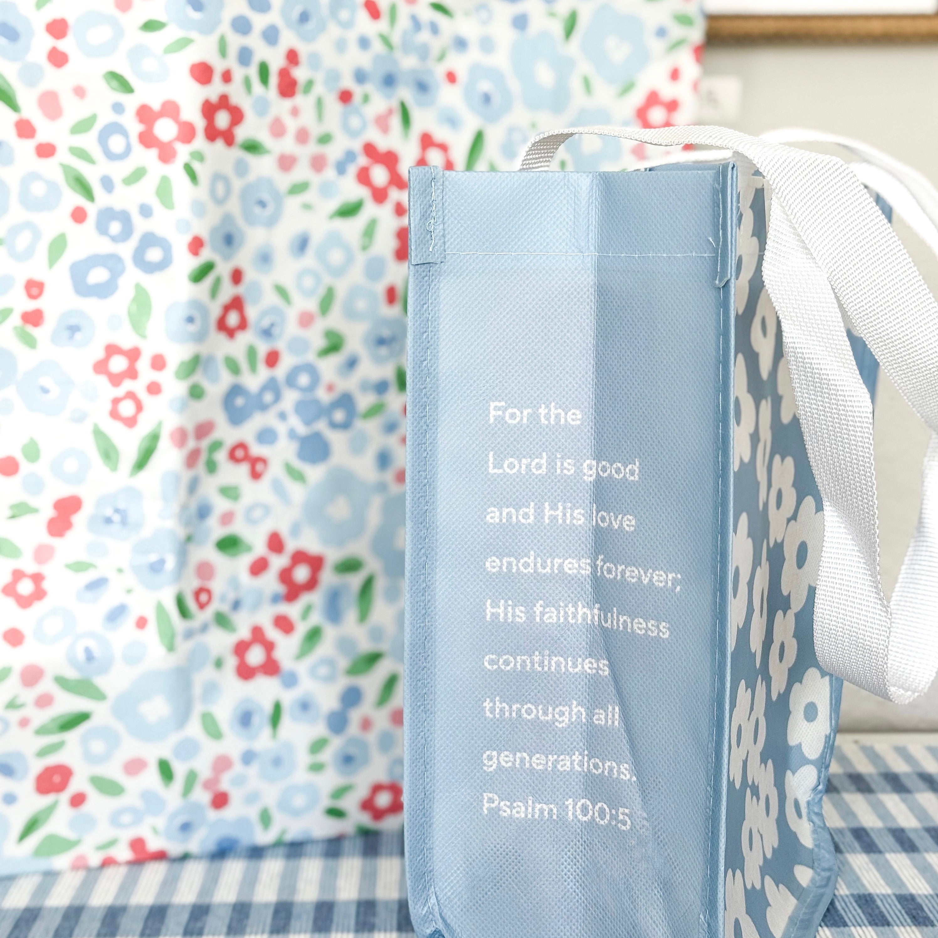 Blue bag with a verse on a floral background