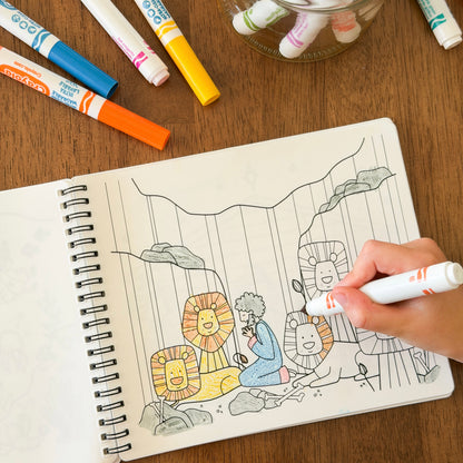 Child coloring with markers 