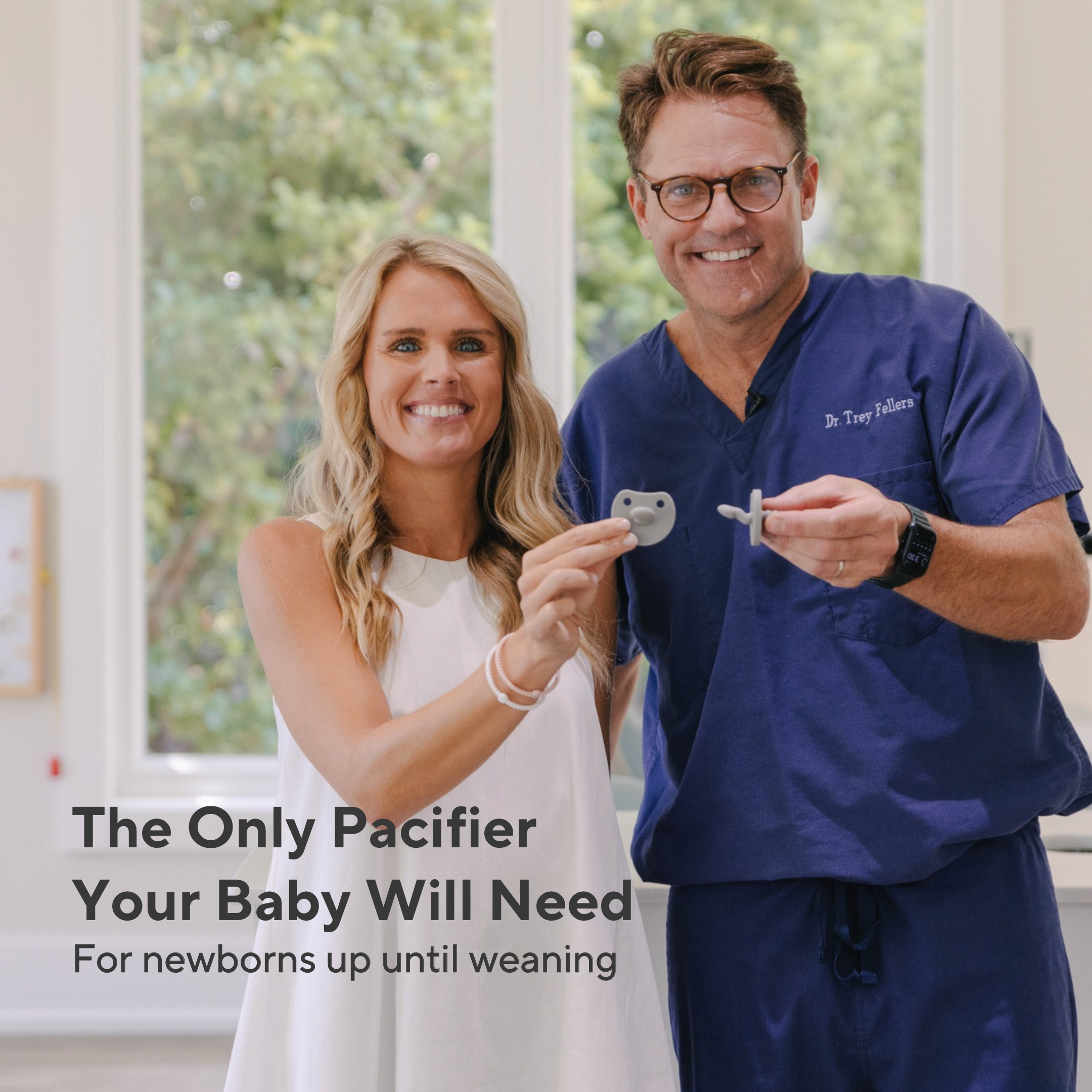 A smiling woman in a white sleeveless dress and a man in blue medical scrubs hold pacifiers in a bright indoor setting. Text on the left reads, &
