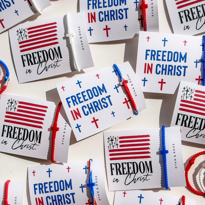 Stickers with 'Freedom in Christ' text and American flag design on a white background