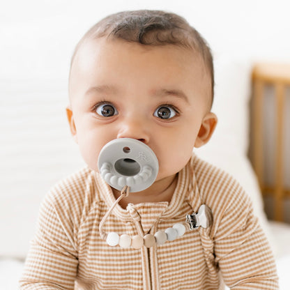 Baby boy using a Slate Cutie PAT and Georgia Cutie Clip.