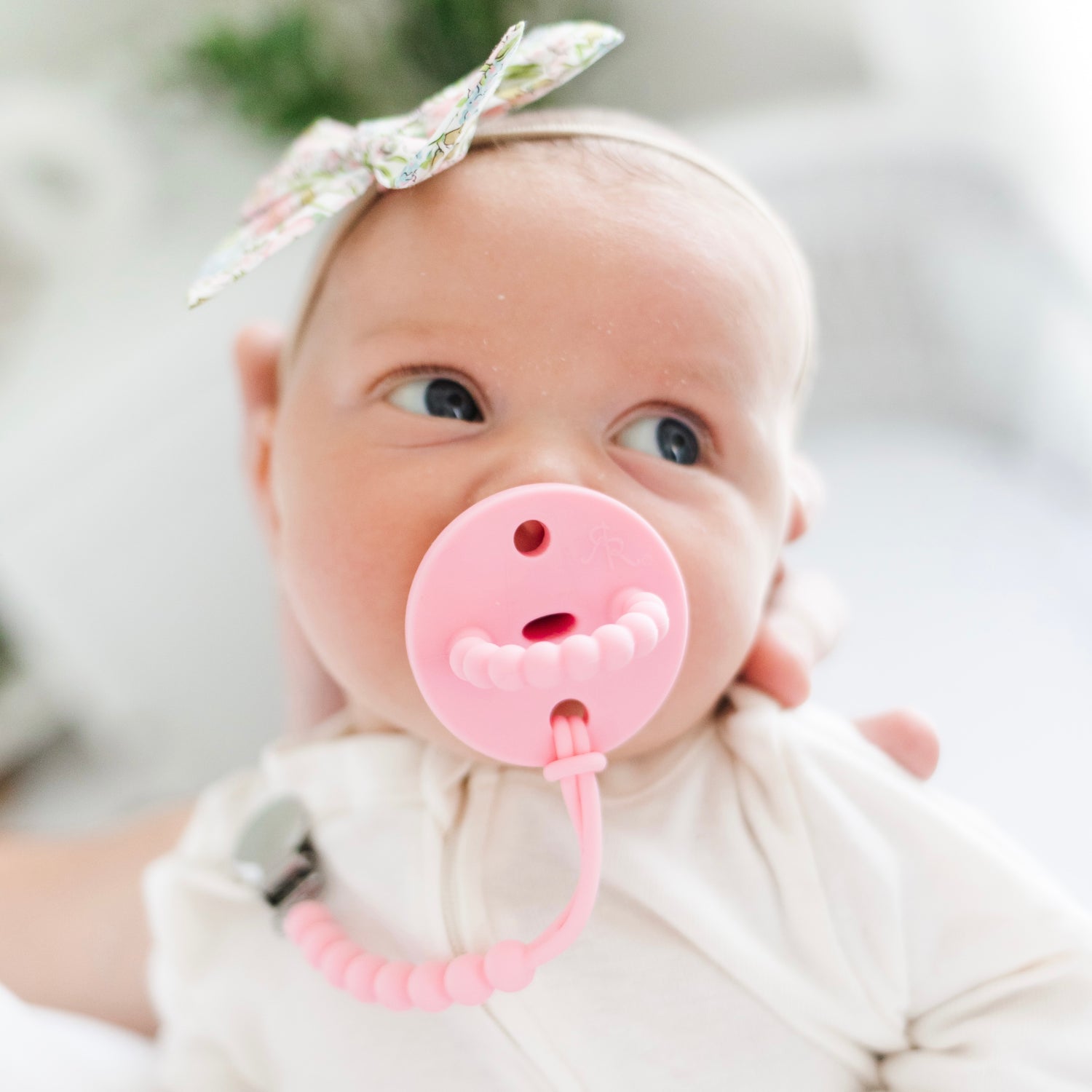 Baby girl wearing a Taffy Cutie PAT and Judy Cutie Clip.