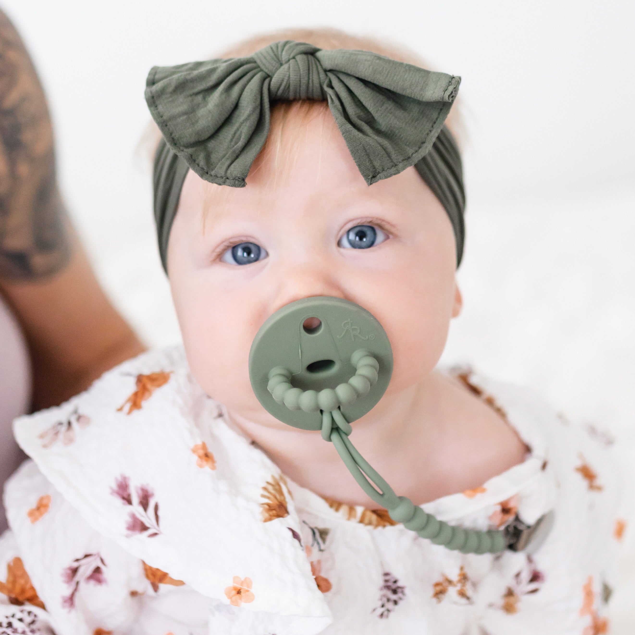 Baby girl wearing an Ivy Cutie PAT and Judy Cutie Clip.