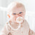 Baby boy wearing an Ivory Cutie PAT and Braiden Cutie Clip.