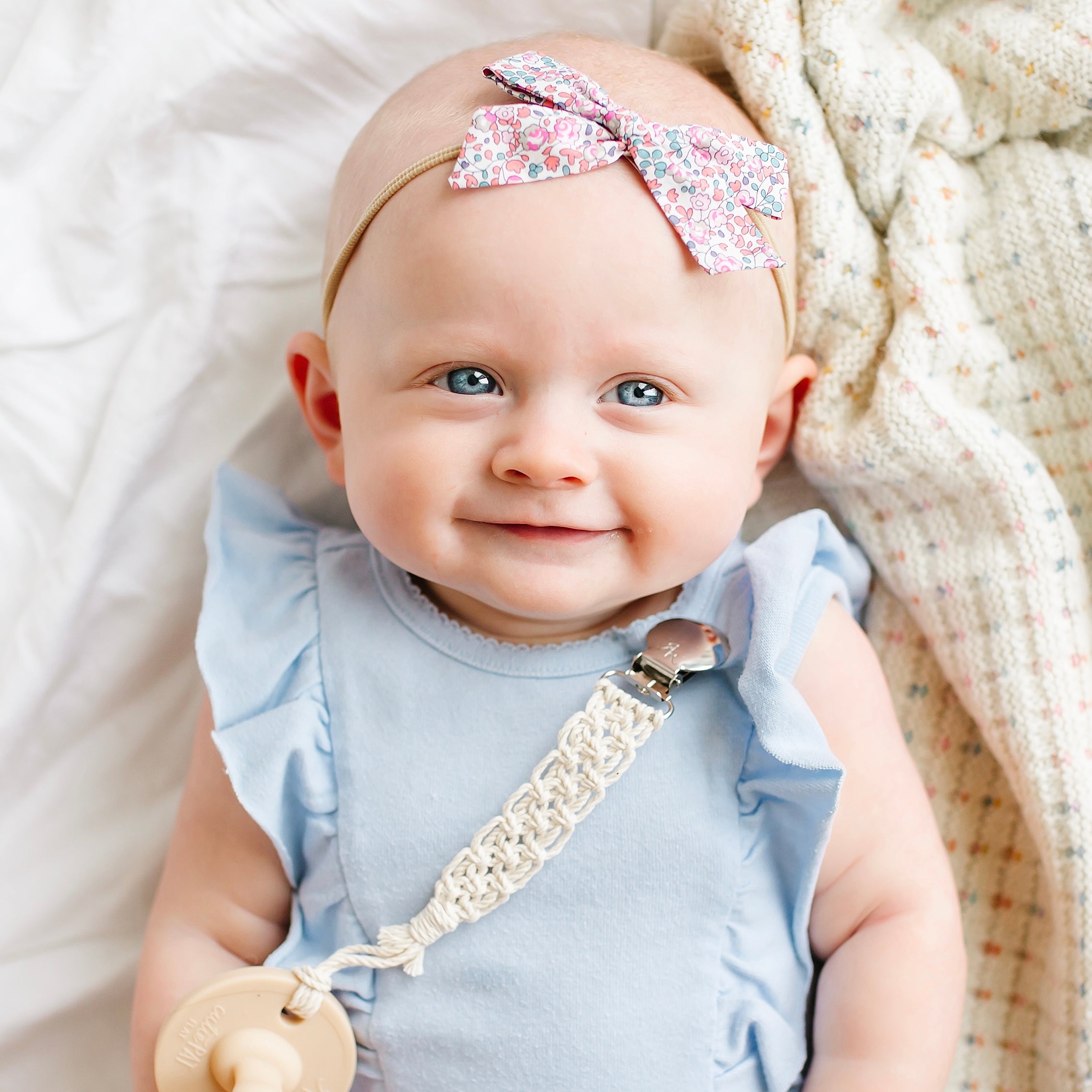 Baby wearing macrame cutie clip