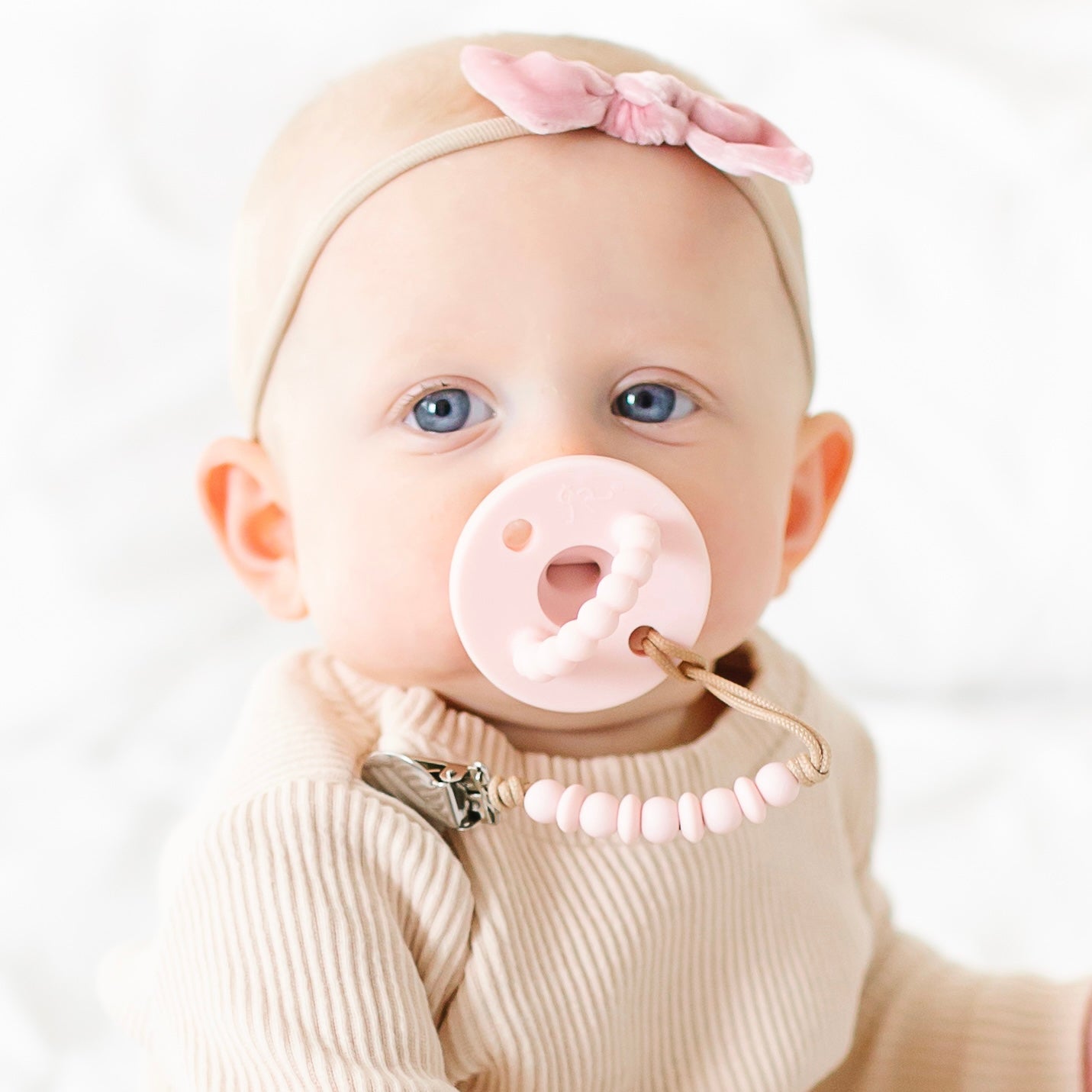 Baby girl wearing a Pink Cutie PAT and Luna Cutie Clip.