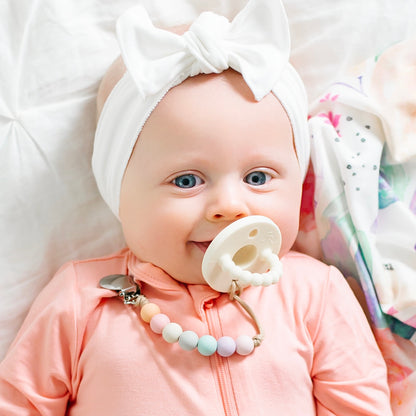 Baby boy using an Ivory Cutie PAT and Georgia Cutie Clip.