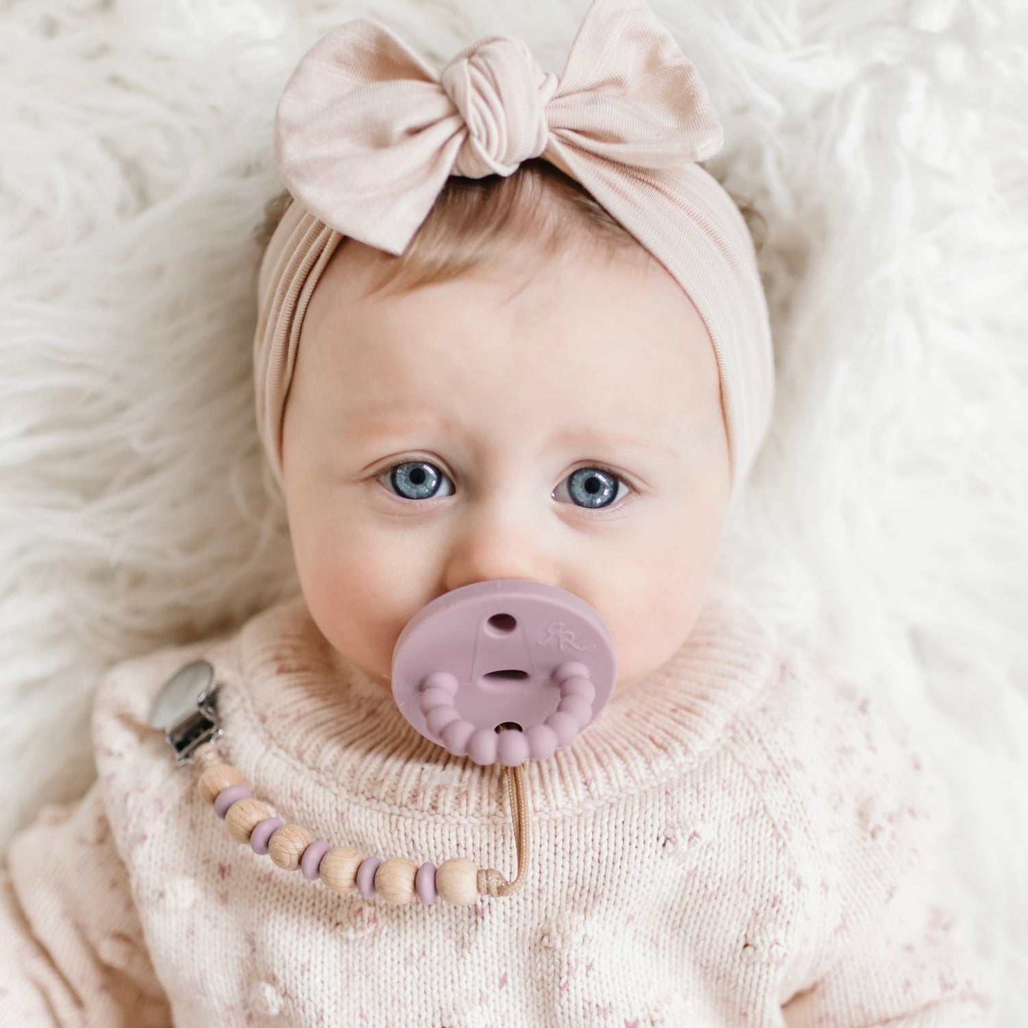 Baby girl wearing a Wisteria Cutie PAT and Ella Cutie Clip.