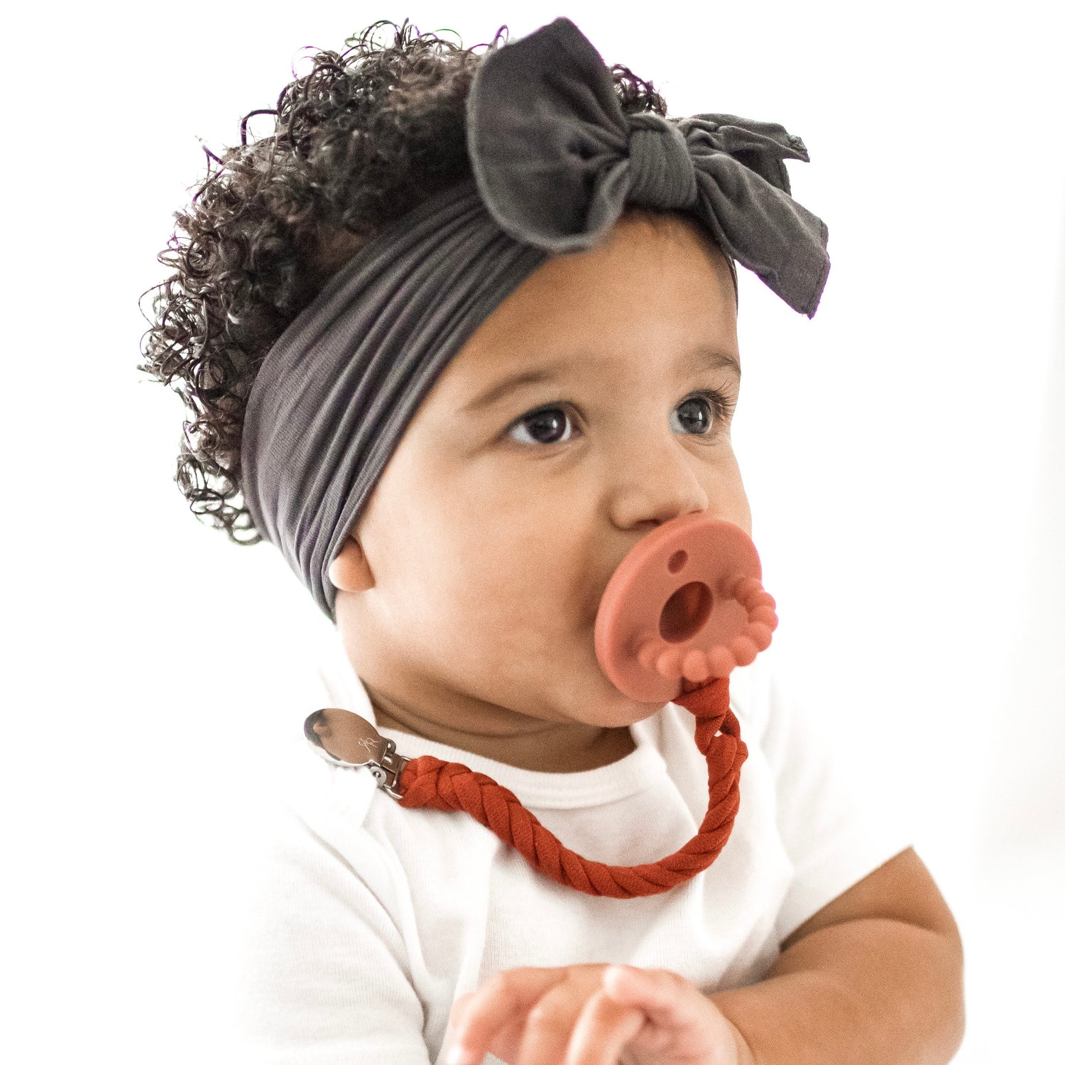 Baby girl wearing a Clay Cutie PAT and Finn Cutie Clip.
