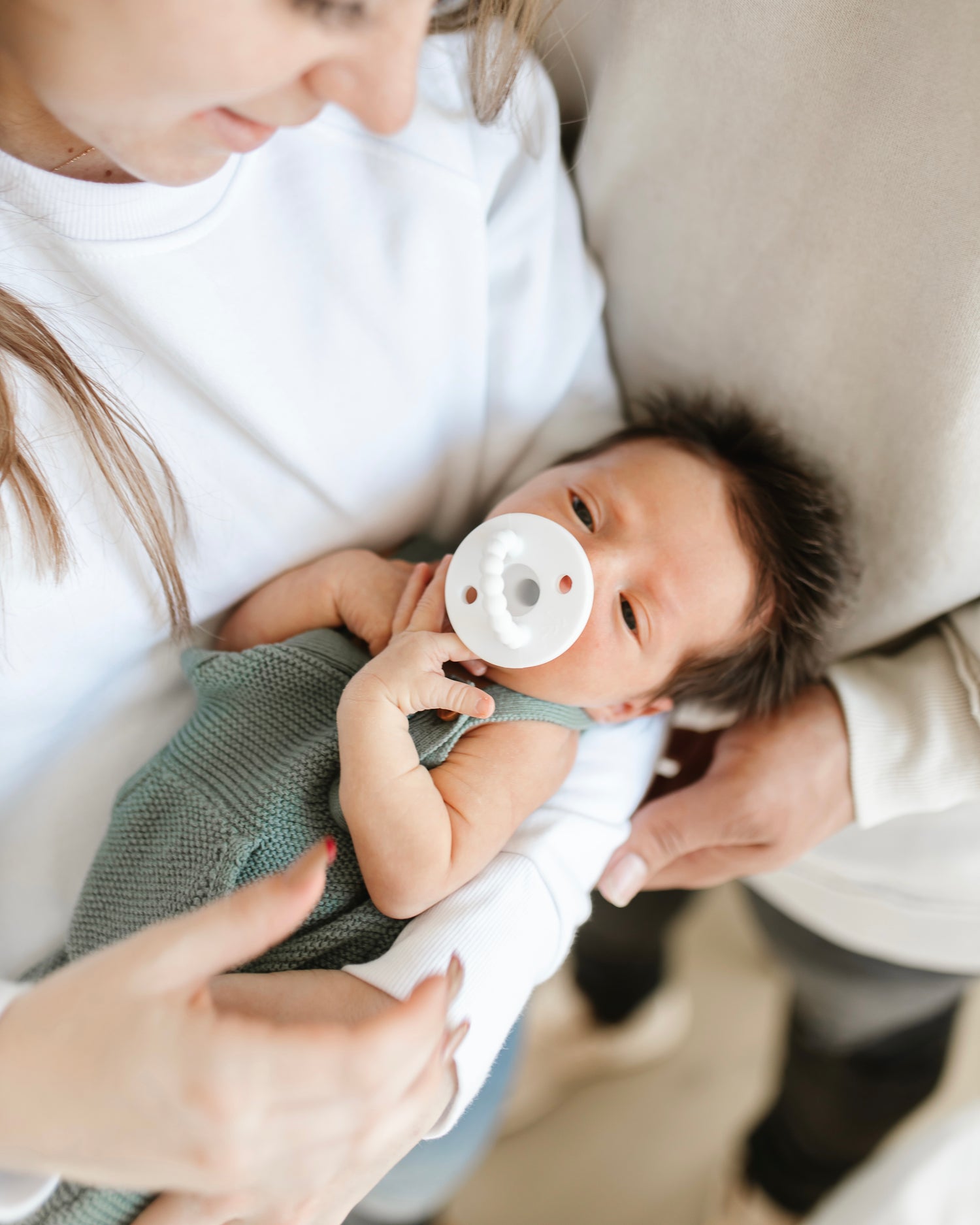 Parents holding baby