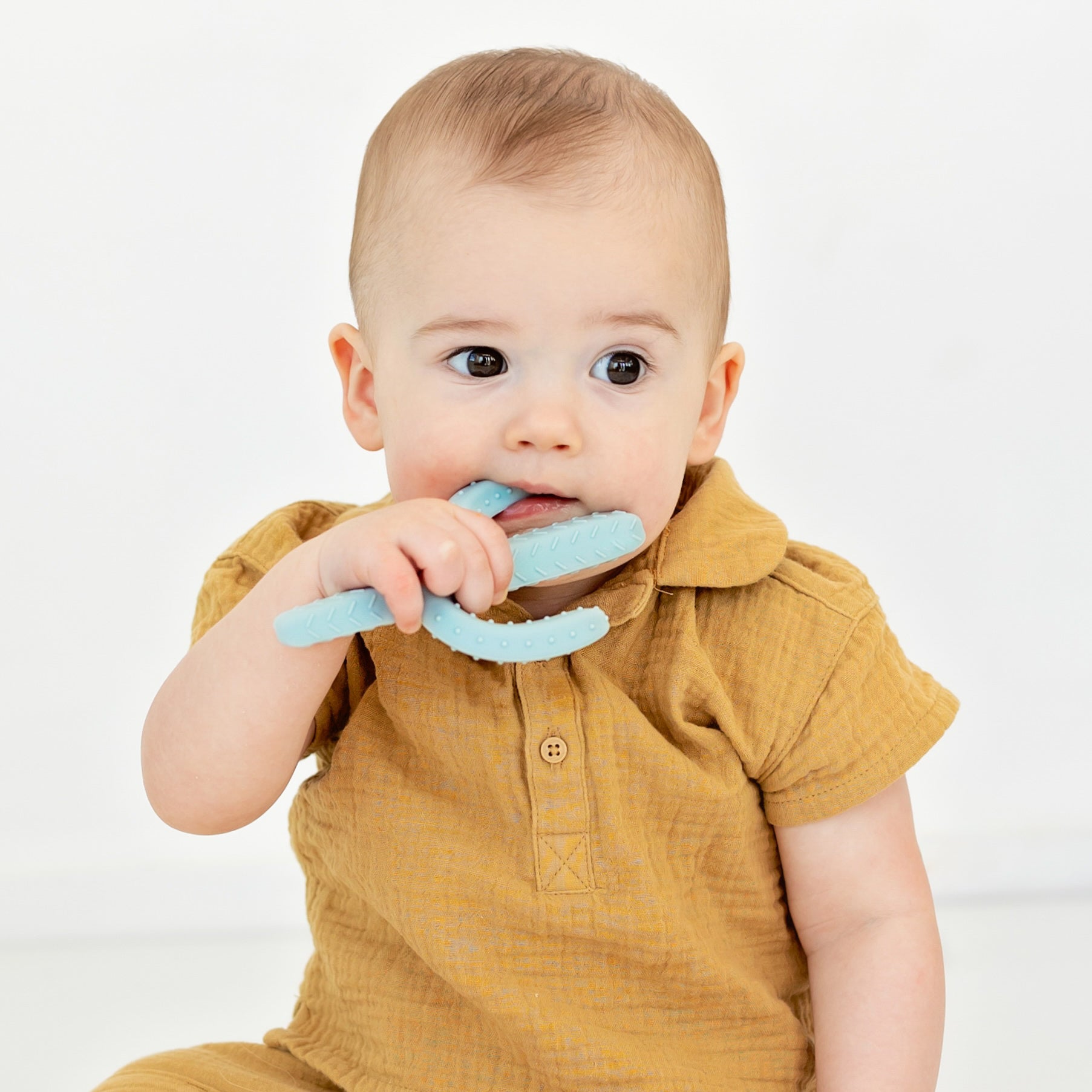 Baby playing with a Cactus Teether