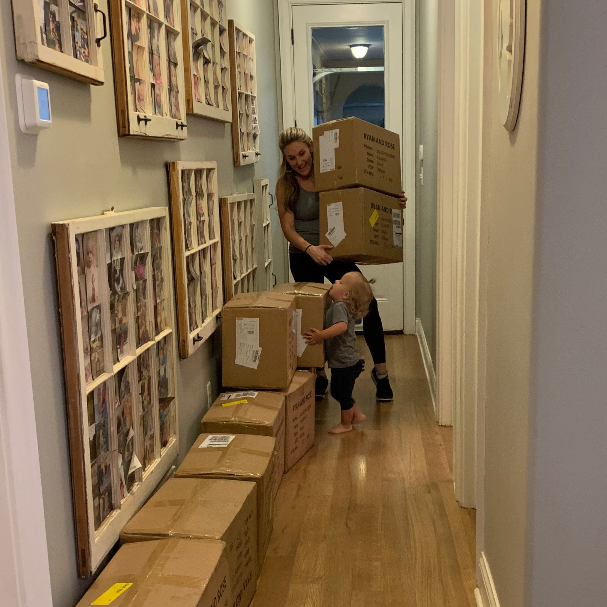 Whitney bringing boxes in the house