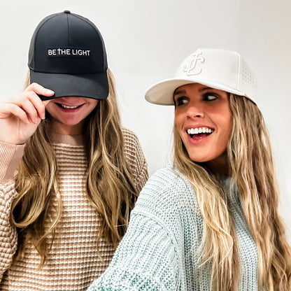 Women wearing Jesus Christ and Be The Light Hats