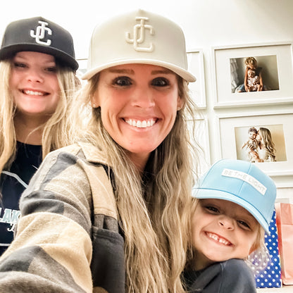 Family wearing Jesus Christ and Be The Light Hats