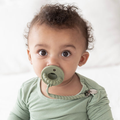 Baby boy wearing an Ivy Cutie PAT and Roper Cutie Clip.