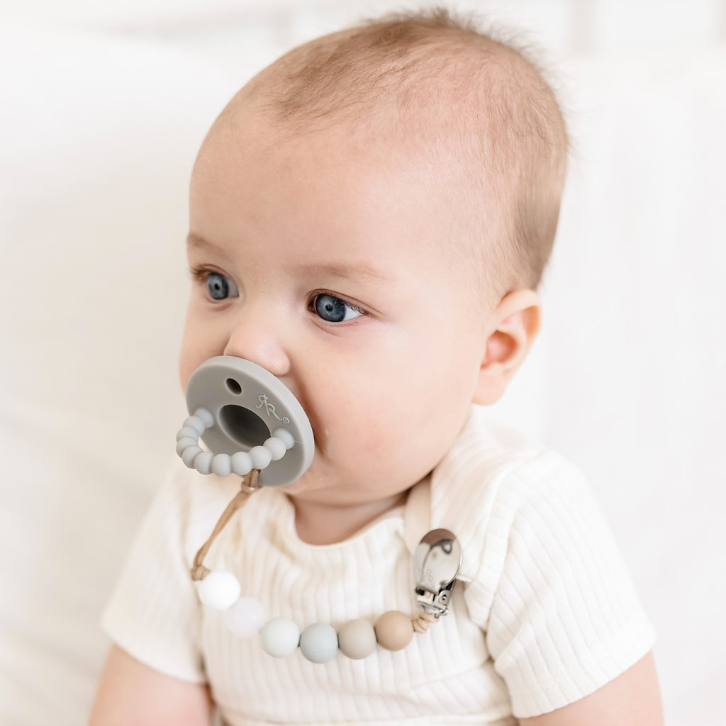 Baby boy wearing a Slate Cutie PAT and Willard Cutie Clip.