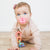 Baby girl crawling wearing the Mosaic Cutie Clinks.
